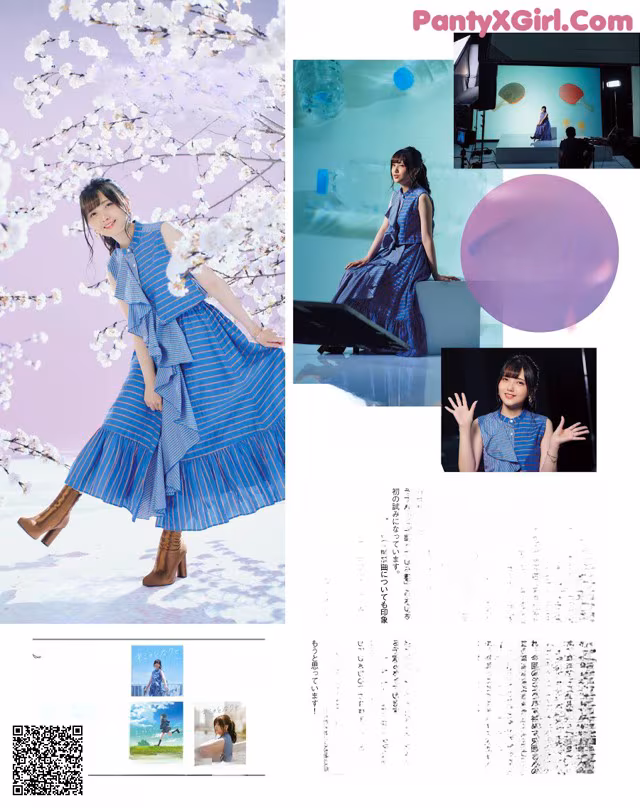 A woman in a blue dress standing in front of a tree.